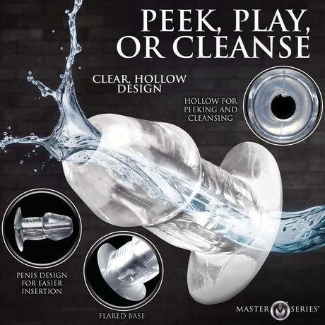 Master Series Dicked Clear Hollow Anal Plug Medium featuring a clear, hollow design for adventurous play and easy cleansing.