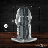 Master Series Dicked Clear Hollow Anal Plug Medium with dimensions on a wooden background, phthalate free.