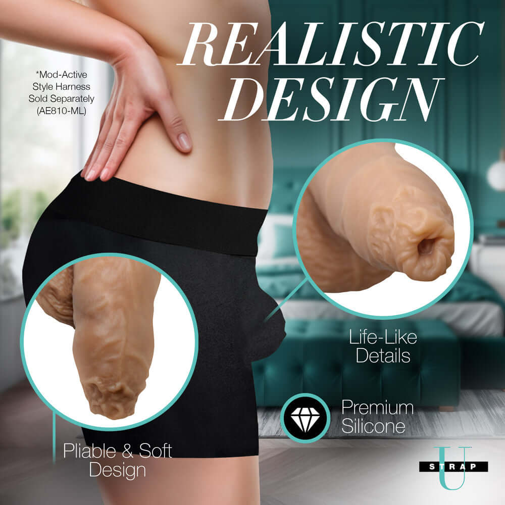 Strap U 5.1 inch Uncut Silicone Packer Dildo Medium displayed on a person wearing shorts, showcasing its realistic design.
