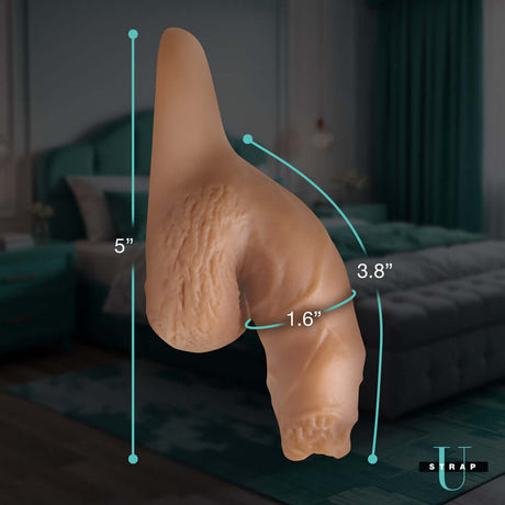 Strap U 5.1 inch Uncut Silicone Packer Dildo Medium showing realistic details and measurements in a cozy bedroom setting.