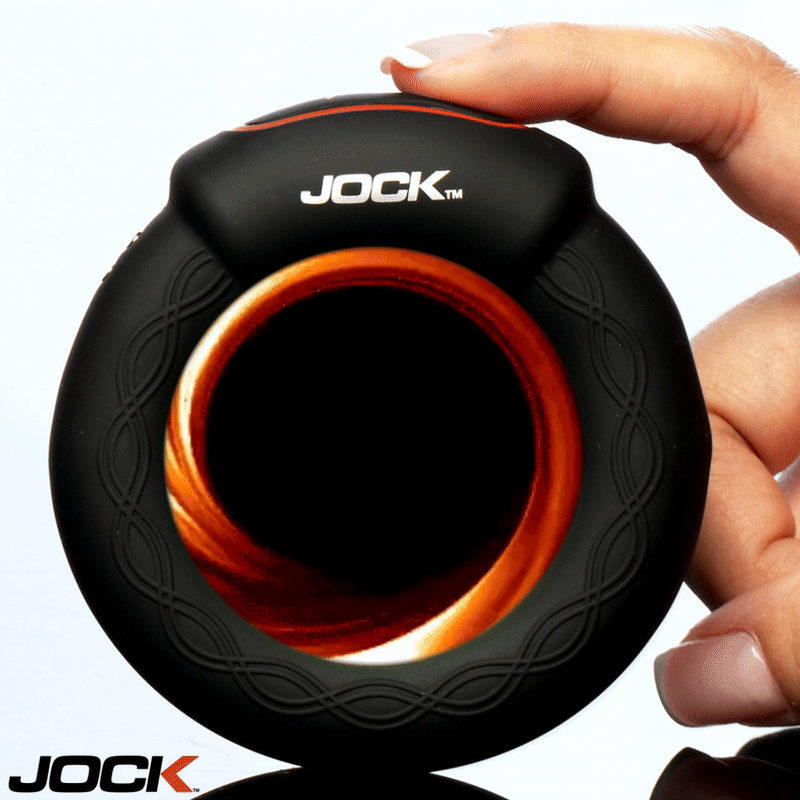 JOCK Rumbler 1.8 inch Vibrating & Warming C-Ring held in hand, showcasing its sleek design and body-safe silicone material.
