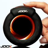 JOCK Rumbler 1.8 inch Vibrating & Warming C-Ring held in hand, showcasing its sleek design and body-safe silicone material.