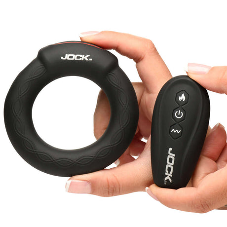 JOCK Rumbler 2 inch Vibrating & Warming C-Ring and remote control in hand for enhanced stimulation