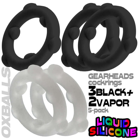 Oxballs Gearheads 5-Pack Spinner Rings Black Vapor, featuring three black and two clear spinner rings made of liquid silicone.