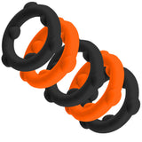 Oxballs Gearheads 5-Pack Spinner Rings Orange Black displayed in a stack showcasing the vibrant colors and design.