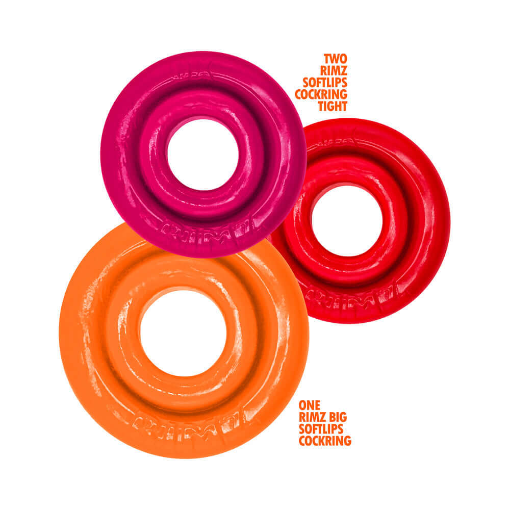 Oxballs Rimringz Multi Size 3-Pack Fire Hots featuring two tight cock rings in pink and red, and one larger orange ring.