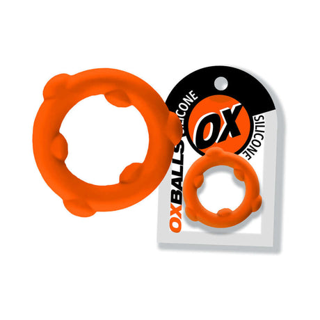 Oxballs Spinner Single Silicone Ring Orange displayed with packaging, featuring a flexible design and textured grip.