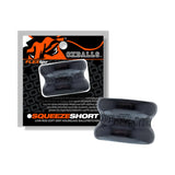 Oxballs Squeeze Short Ballstretcher Black displayed with its packaging on a white background.