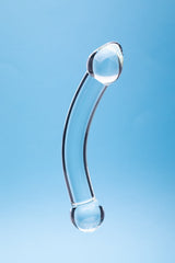 Clarity Celestial Purity Glass Dildo showcased against a light blue background, highlighting its elegant design.