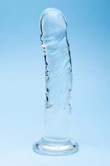 Clarity Seraphic Rapture Glass Dildo displayed against a blue background, showcasing its clear handblown design.