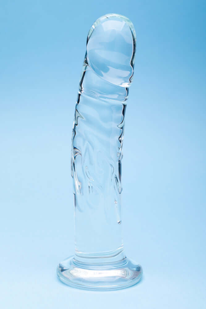 Clarity Seraphic Rapture Glass Dildo on blue background showcasing its handblown design and smooth surface.