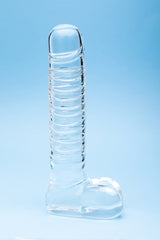 Clarity Seraphic Opus Glass Dildo on a blue background, showcasing its elegant design and handblown craftsmanship.
