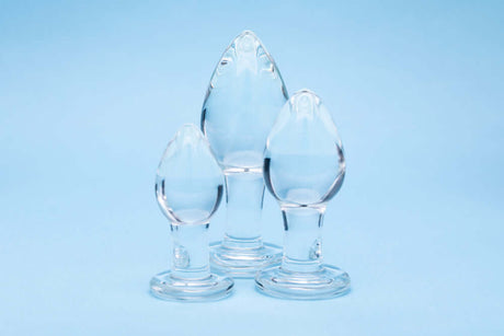 Clarity Utopian Trinity Glass Plug Set featuring three handcrafted glass plugs on a blue background.