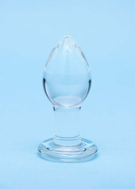 Clarity Utopian Trinity Glass Plug Set - a premium borosilicate glass butt plug on a blue background.
