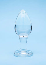 Clarity Utopian Trinity Glass Plug Set displayed against a blue background, showcasing the elegant design of a glass butt plug.
