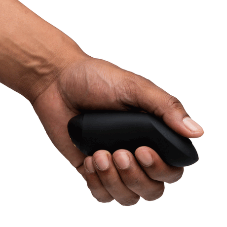 We-Vibe Chorus Couples Vibrator with Remote Control Black held in hand, showcasing sleek design and ergonomic shape.