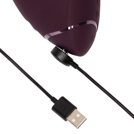Womanizer Next Duo Massager Dark Purple with USB charging cable attached for easy power.