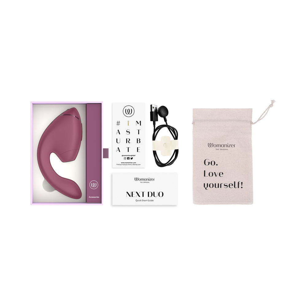 Womanizer Next Duo Massager Dusky Pink in packaging with accessories and care instructions.