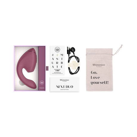 Womanizer Next Duo Massager Dusky Pink in packaging with accessories and care instructions.