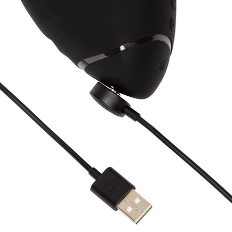 Close-up of the charging port and USB cable of the Womanizer Next Duo Massager Black.