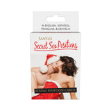 Santas Secret Sex Positions Cards box design featuring a couple in festive attire and text for multilingual instructions.