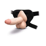 b-Vibe Slipskin Realistic Silicone Dildo 6 inch Girthy Cream in a harness for strap-on use.