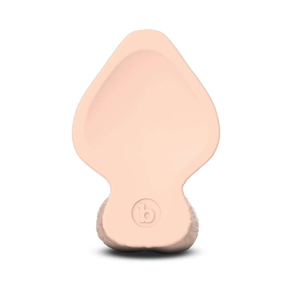 Bottom view of the b-Vibe Slipskin Realistic Silicone Dildo 7 inch Girthy Cream, showcasing its lifelike design.