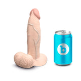 b-Vibe Slipskin Realistic Silicone Dildo 7 inch Girthy Cream next to a can for size comparison.