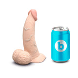 b-Vibe Slipskin Realistic Silicone Dildo 6.5 inch Curved Cream next to a can for size reference.