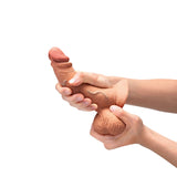 b-Vibe Slipskin Realistic Silicone Dildo 6.5 inch Curved Mocha held in hands, showcasing lifelike texture.