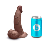 b-Vibe Slipskin Realistic Silicone Dildo 6.5 inch Curved Brown next to a soda can for size comparison