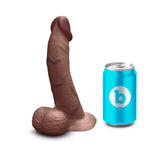 b-Vibe Slipskin Realistic Silicone Dildo 8 inch Curved Brown next to a soda can for size comparison.
