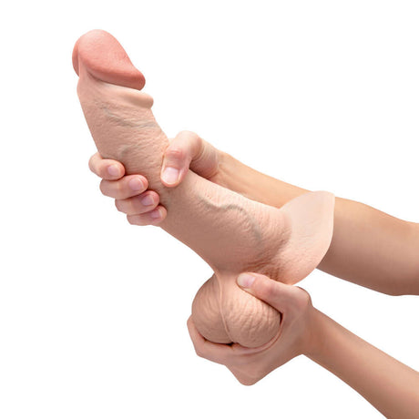 b-Vibe Slipskin Realistic Silicone Dildo 10 inch Curved Cream held in hands, showcasing its lifelike design.
