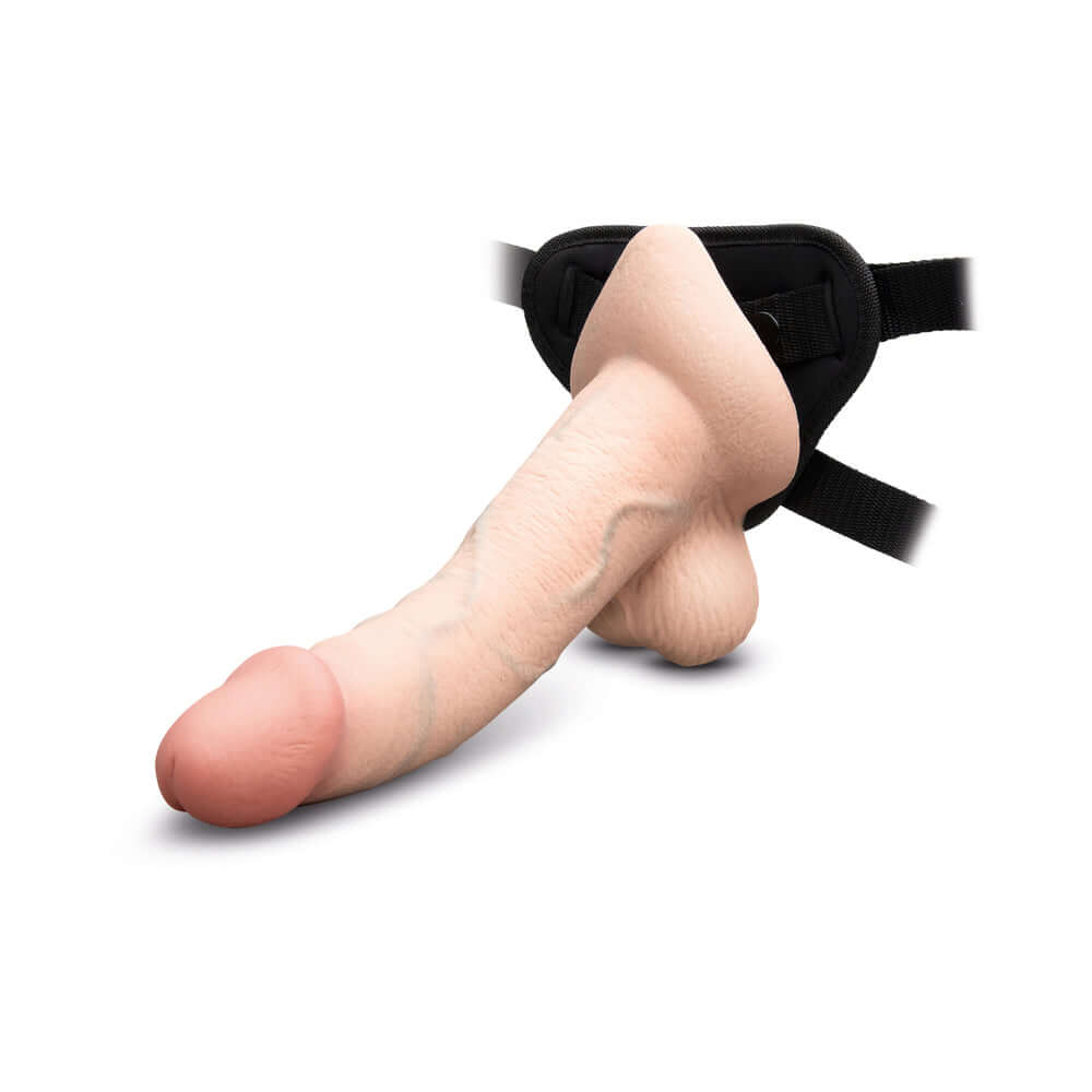 b-Vibe Slipskin Realistic Silicone Dildo 10 inch Curved Cream on harness, realistic design with soft silicone material.