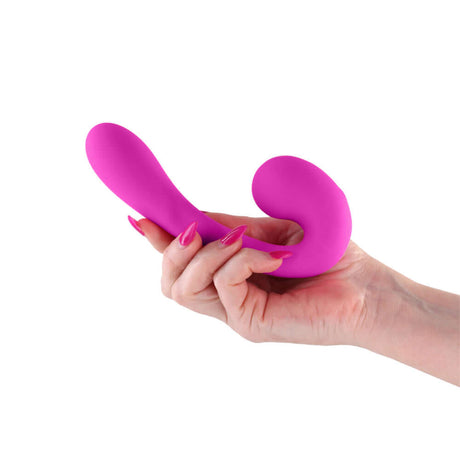 Person holding the Gold-n-Dreams Maria Morganite Vibrator in a vibrant pink color.