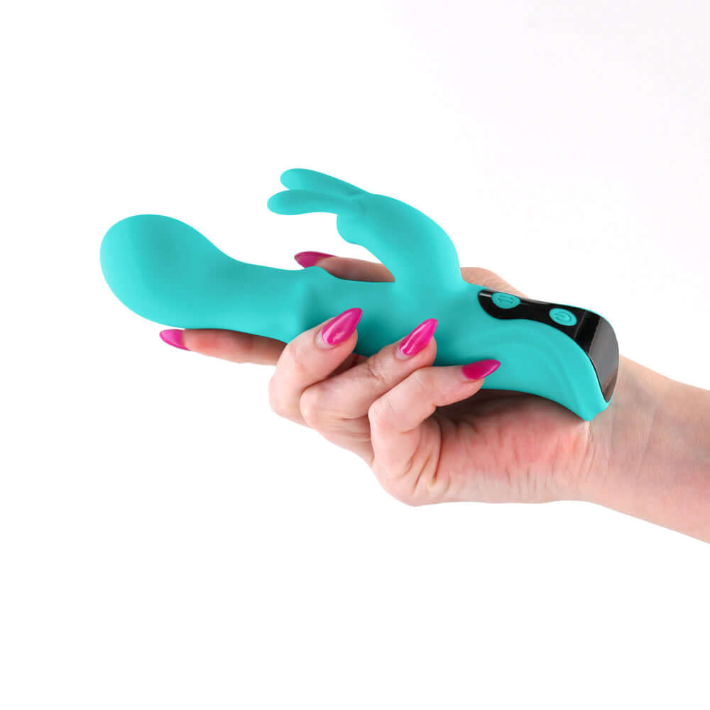 INYA Cyberluxe Digital Rabbit Vibrator Aqua held in hand, showcasing its dual-stimulation design and vibrant color.