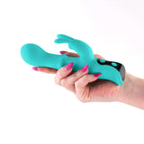 INYA Cyberluxe Digital Rabbit Vibrator Aqua held in hand, showcasing its dual-stimulation design and vibrant color.