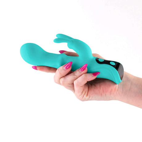 INYA Cyberluxe Digital Rabbit Vibrator Aqua held in hand, showcasing its dual-stimulation design and vibrant color.