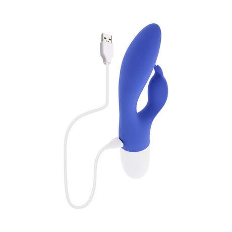 Evolved Funny Bunny Vibrator Blue charging with USB cable, designed for dual stimulation and intense pleasure.