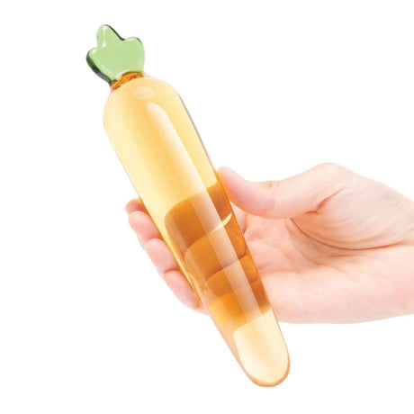 Glas Bunnys Secret 7.25 inches Glass Dildo held in hand, featuring a playful carrot design and elegant borosilicate glass.