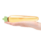 Glas Bunnys Secret 7.25 inches Glass Dildo held in hand, showcasing its elegant carrot shape design.