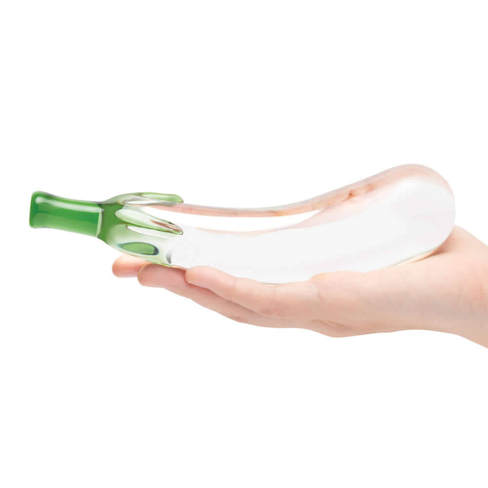 Glas Eggplant Ecstasy 7.25 inches Glass Dildo held in hand, showcasing its whimsical eggplant design.