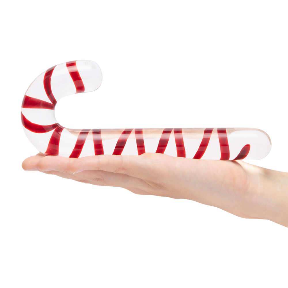 Glas Candy Cane Dream 7.5 inches Glass Dildo held in hand showcasing its festive red and white swirl design.