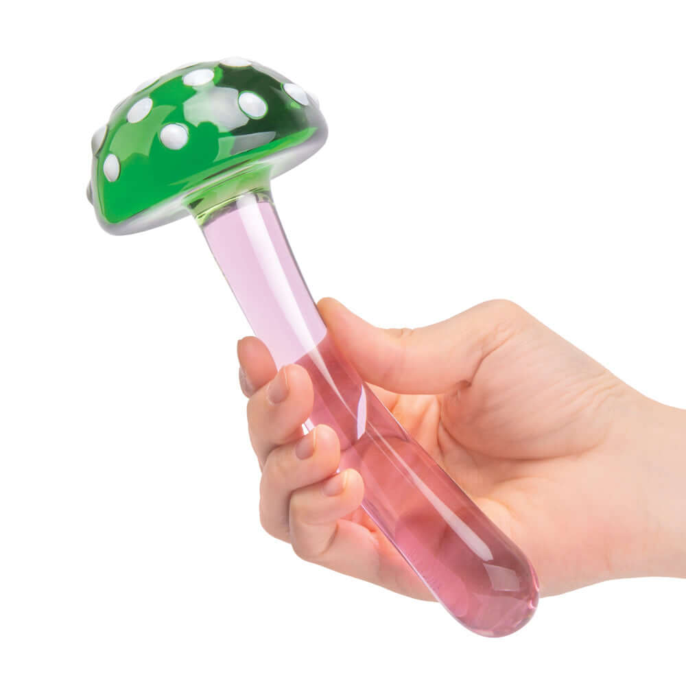 Glas Magic Mushroom Dildo 7.5 inches Glass Dildo held in hand, featuring vibrant green cap and pink stem.
