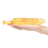 Glas Cornstar 8 inches Glass Dildo held in a hand, showcasing its corn-on-the-cob design and textured surface.
