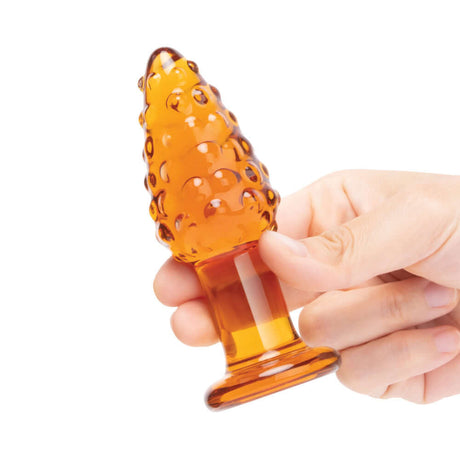 Glas Cornstar 4 inches Glass Butt Plug held in hand, showcasing its playful design and texture.