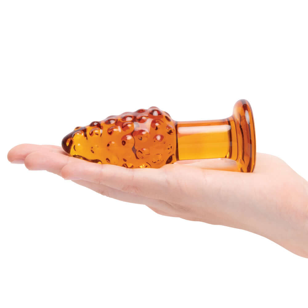 Glas Cornstar 4 inches Glass Butt Plug held in hand showcasing its corn-on-the-cob design and textured surface.