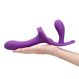 Together Lock-In Dual-Ended Vibrating Strap-on & Harness Set held in hand, showcasing innovative design for shared pleasure.