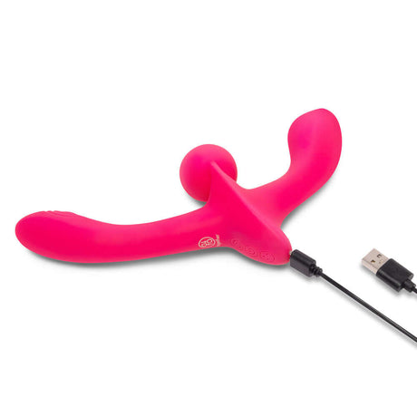Together Double Tap Dual-Ended Vibrating Strapless Strap-on in vibrant pink with USB charging cable.