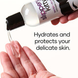 Slippery Kitty Hybrid Lubricant 4 Oz pouring into a hand, hydrating and protecting delicate skin.